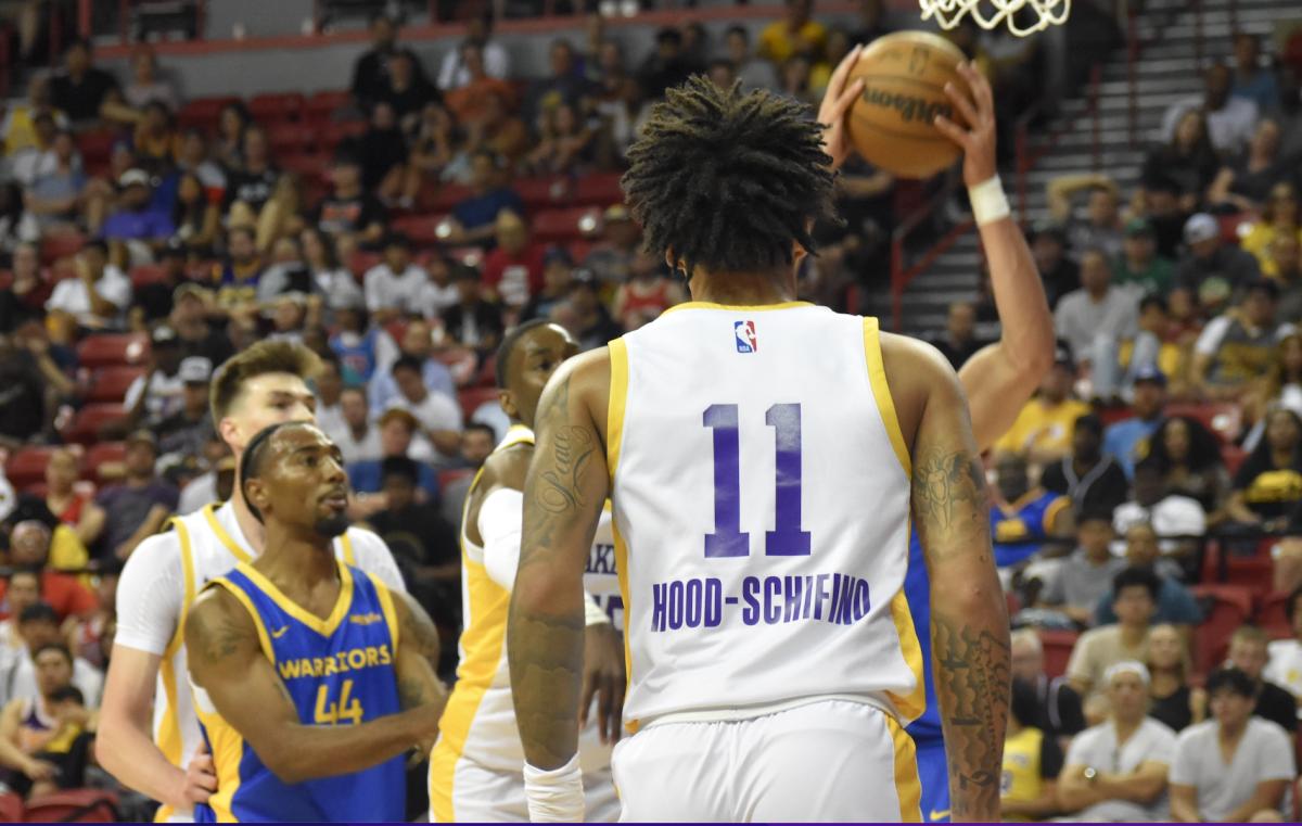 Jalen Hood-Schifino dons his new purple and gold Lakers uniform and number.
